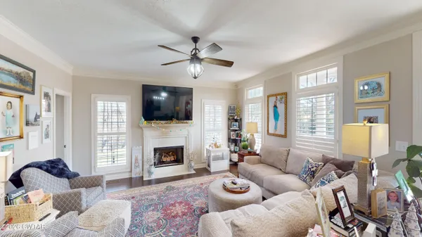 a living room with furniture fireplace and a flat screen tv