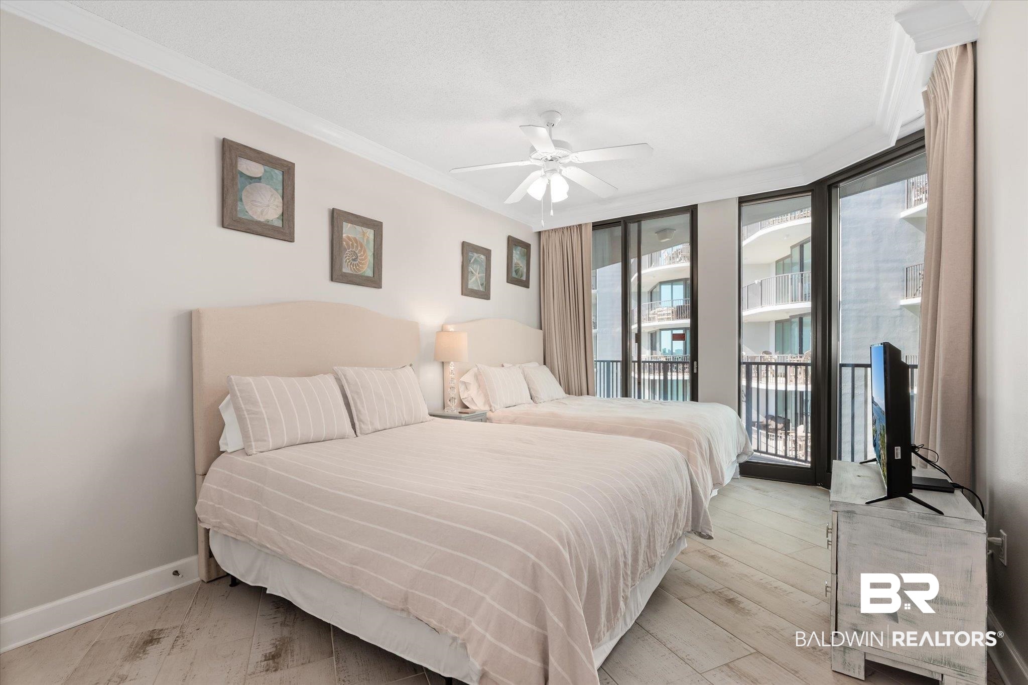 27582 Canal Road, Unit 2611 Orange Beach, AL 36561 - Photo 23 of 37 Bedroom featuring access to outside, ornamental molding, ceiling fan, and light hardwood / wood-style flooring