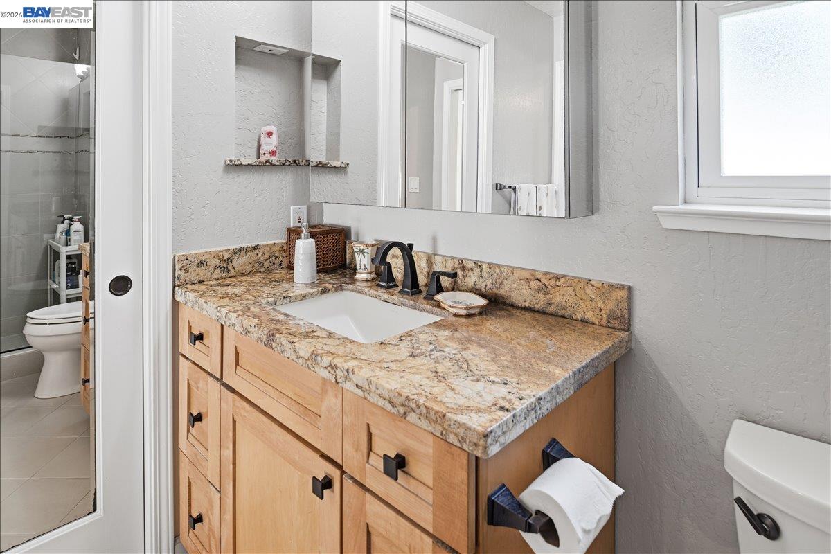 2861 Millbridge Place San Ramon, CA 94583 - Photo 32 of 58 a bathroom with a sink toilet and mirror