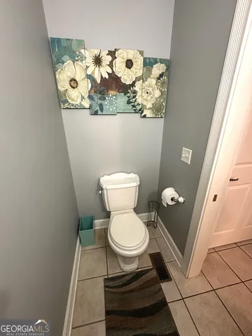 a bathroom with a toilet and a sink