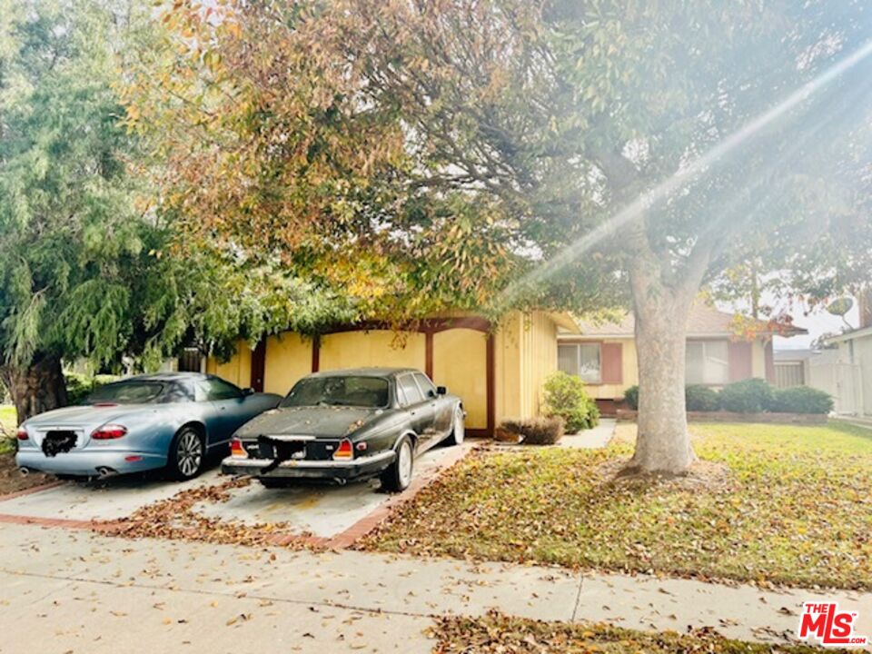 1706 East Edom Street Carson, CA 90746 - Photo 2 of 6 a view of a car parked in front of a house