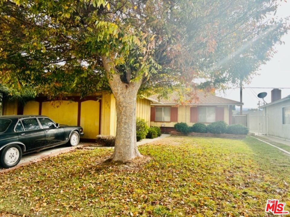 1706 East Edom Street Carson, CA 90746 - Photo 6 of 6 a view of a car parked in front of a house