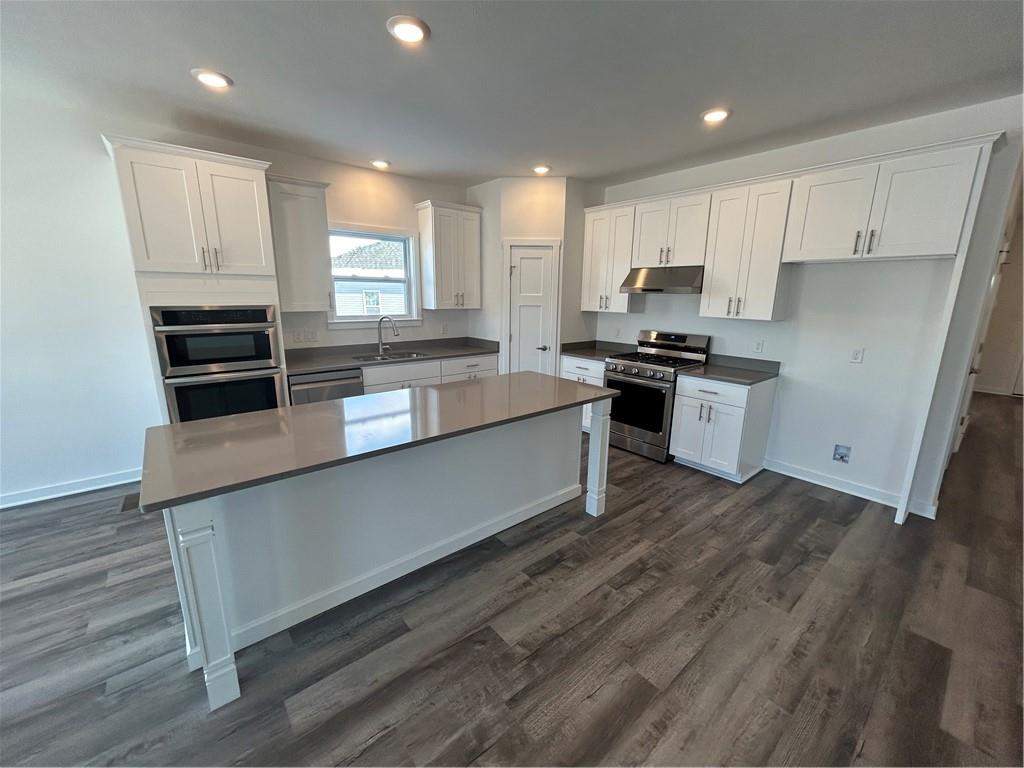 203 Lola Court McKees Rocks, PA 15136 - Photo 13 of 23 a large kitchen with stainless steel appliances granite countertop a stove a sink and a refrigerator