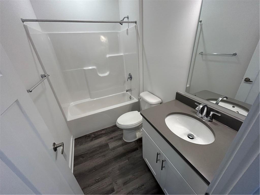 203 Lola Court McKees Rocks, PA 15136 - Photo 7 of 23 a bathroom with a sink a toilet and a mirror