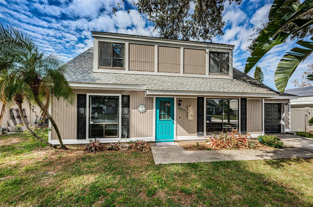 front view of a house with a yard