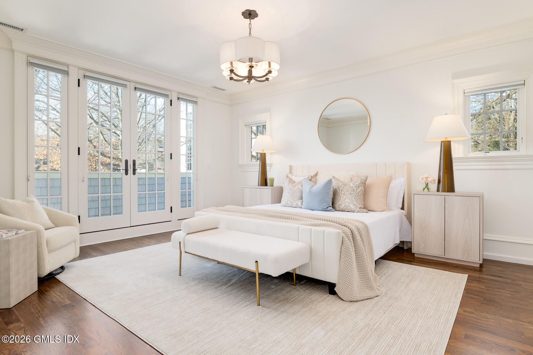 15 Lexington Avenue Greenwich, CT 06830 - Photo 12 of 23 a spacious bedroom with a bed and a large window