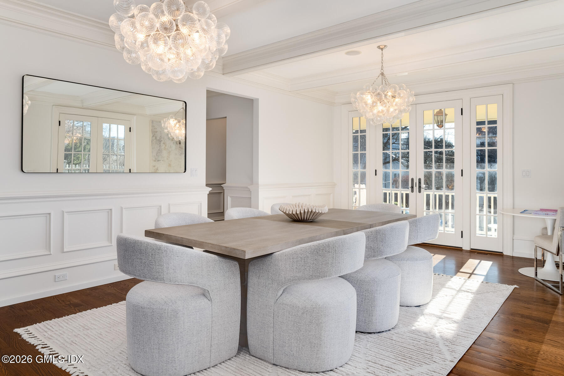 15 Lexington Avenue Greenwich, CT 06830 - Photo 9 of 23 a dining room with furniture and chandelier