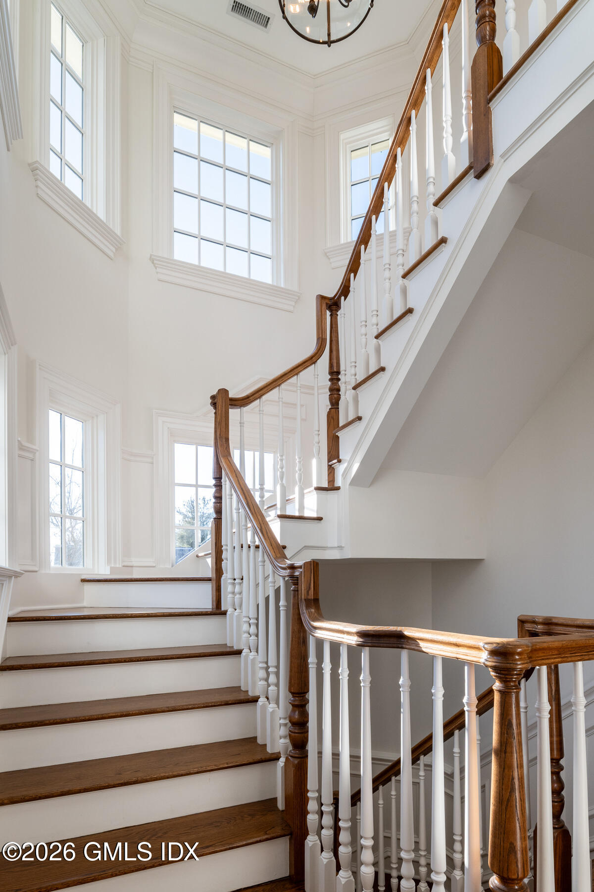 15 Lexington Avenue Greenwich, CT 06830 - Photo 10 of 23 a view of entryway with wooden floor and stairs