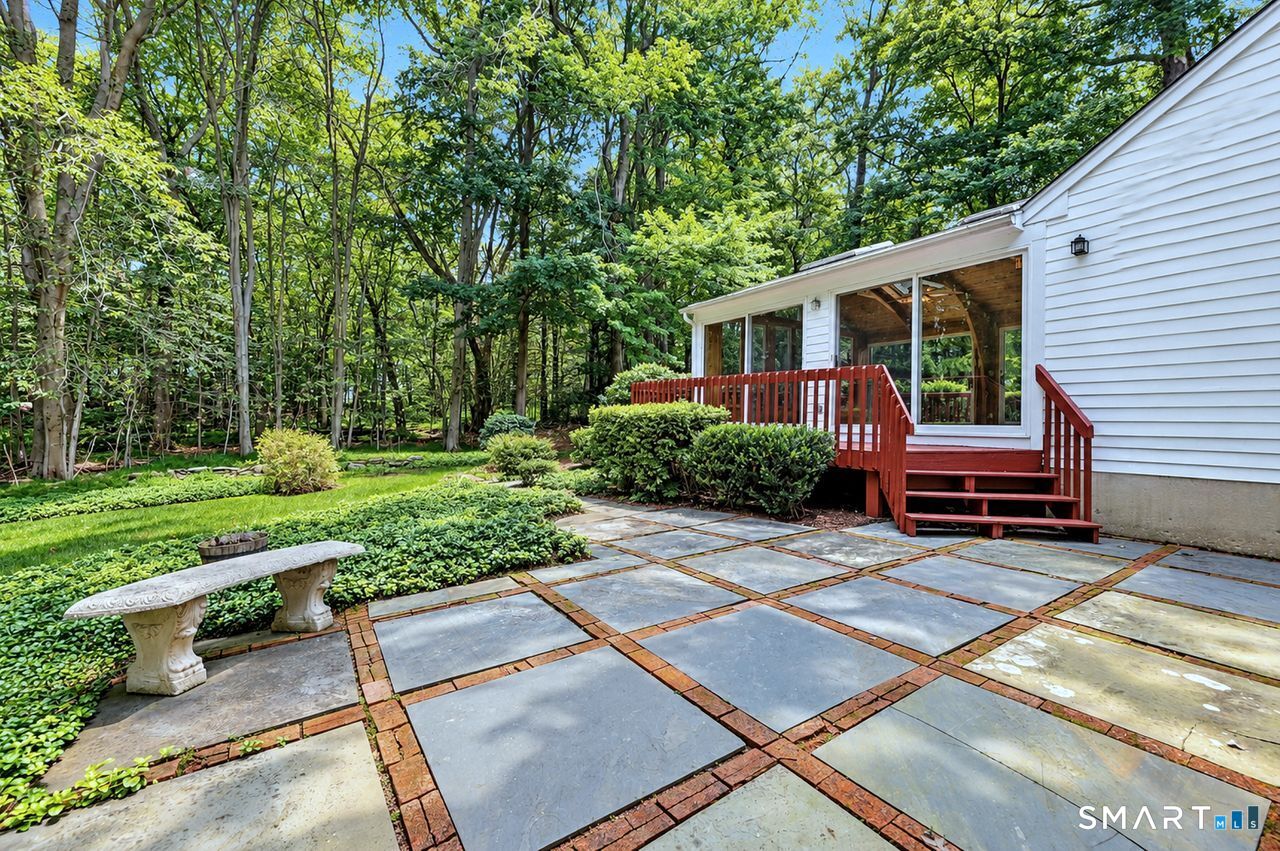185 Nepas Road Fairfield, CT 06825 - Photo 31 of 38 Connect with nature's beauty right in your backyard as you sip a cup of coffee, have dinner or entertain friends and family on your large slate patio.