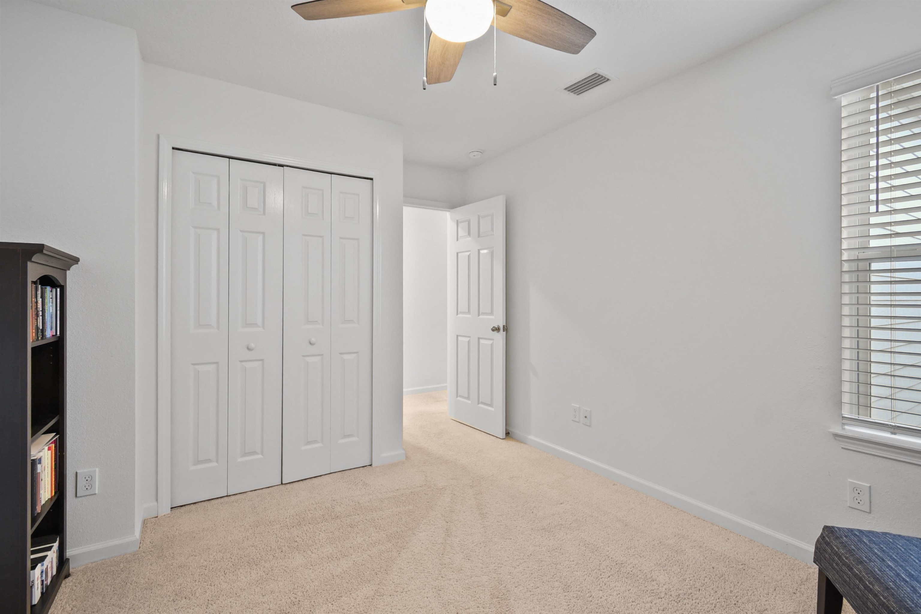105 Ridge Lake Road St. Augustine, FL 32086 - Photo 23 of 34 an empty room with windows and closet