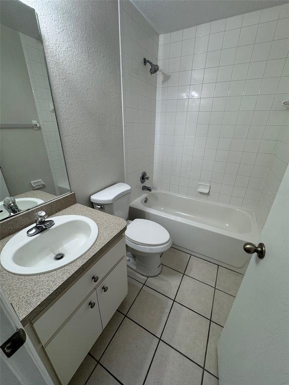 11322 Southeast 55th Avenue Road, Unit 1301 Belleview, FL 34420 - Photo 16 of 20 a bathroom with a sink a toilet and shower