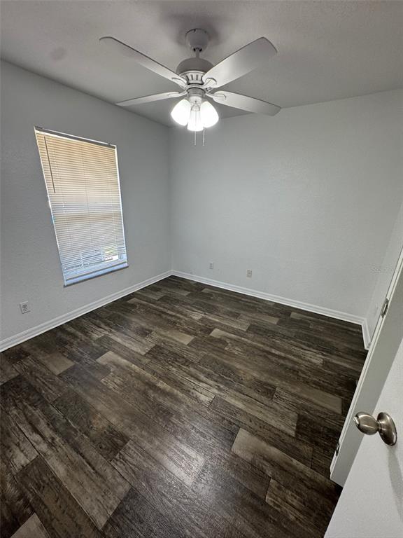 11322 Southeast 55th Avenue Road, Unit 1301 Belleview, FL 34420 - Photo 17 of 20 wooden floor in an empty room with a window
