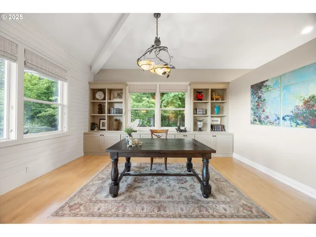 a living room with furniture a window and a table