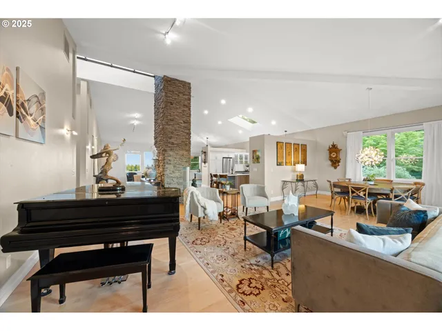 a living room with furniture a piano and a piano
