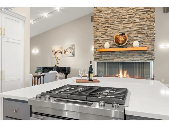 a kitchen with a stove and a fireplace