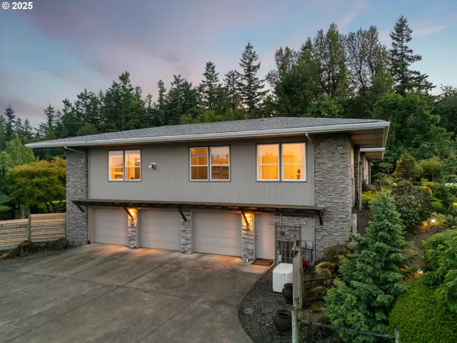 a front view of a house with trees