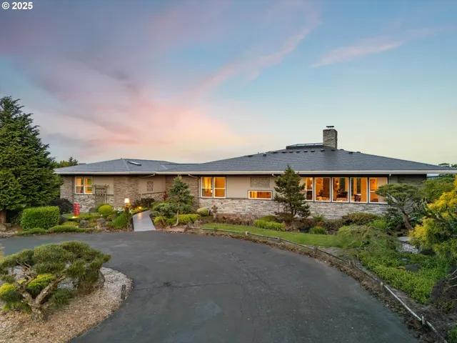 a front view of a house with a yard and outdoor
