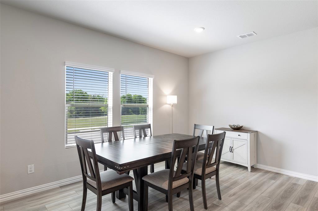 1504 Cobblestone Road Melissa, TX 75454 - Photo 12 of 39 Dedicated dining area framed by backyard views.