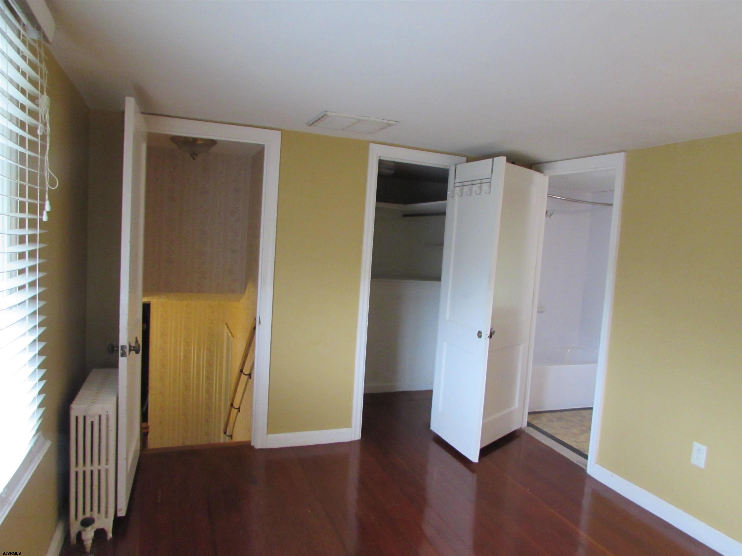 744 Shore Road Linwood, NJ 08221 - Photo 28 of 43 an empty room with wooden floor and a window