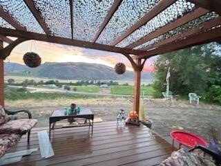 a view of a deck with wooden floor and outdoor space