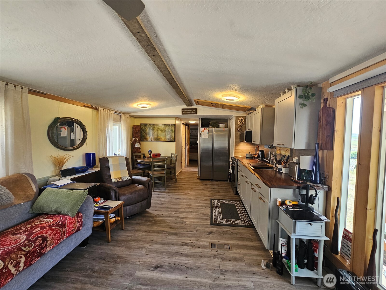 14 Bridgeview Road Tonasket, WA 98855 - Photo 14 of 32 a living room with furniture and a flat screen tv