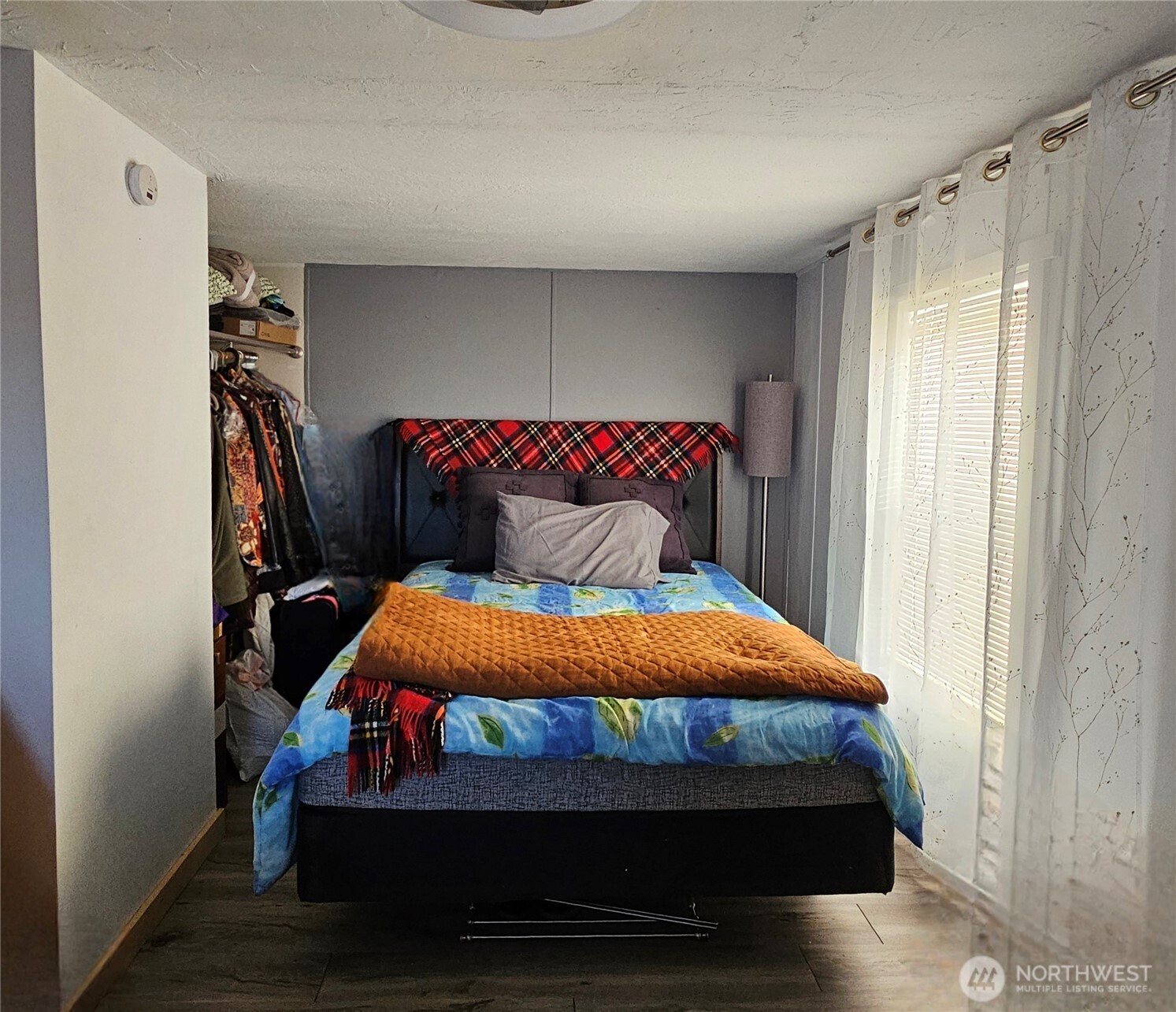 14 Bridgeview Road Tonasket, WA 98855 - Photo 16 of 28 a bedroom with a bed and a window