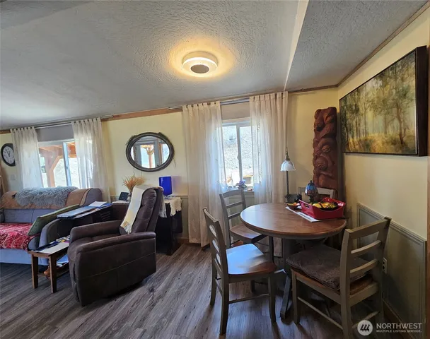 a large bed sitting in a bedroom next to a window