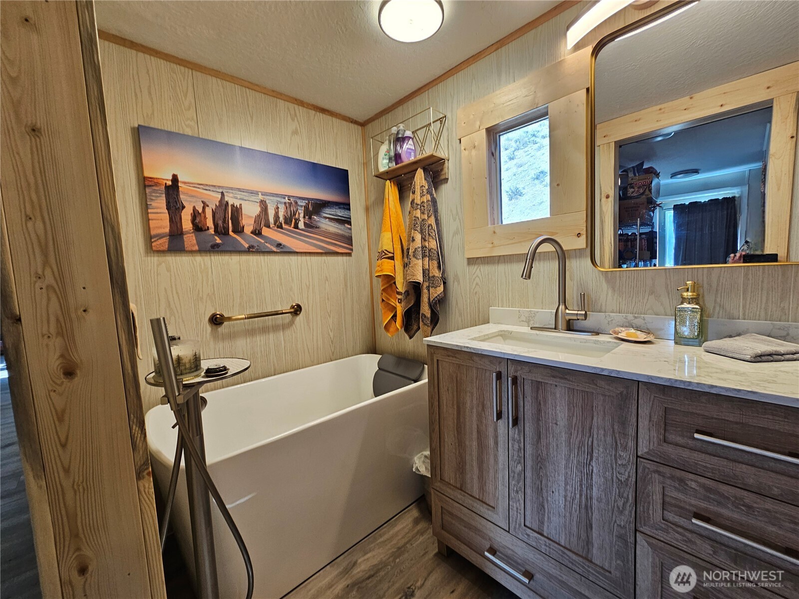 14 Bridgeview Road Tonasket, WA 98855 - Photo 20 of 32 a bathroom with a double vanity sink a tub and a mirror