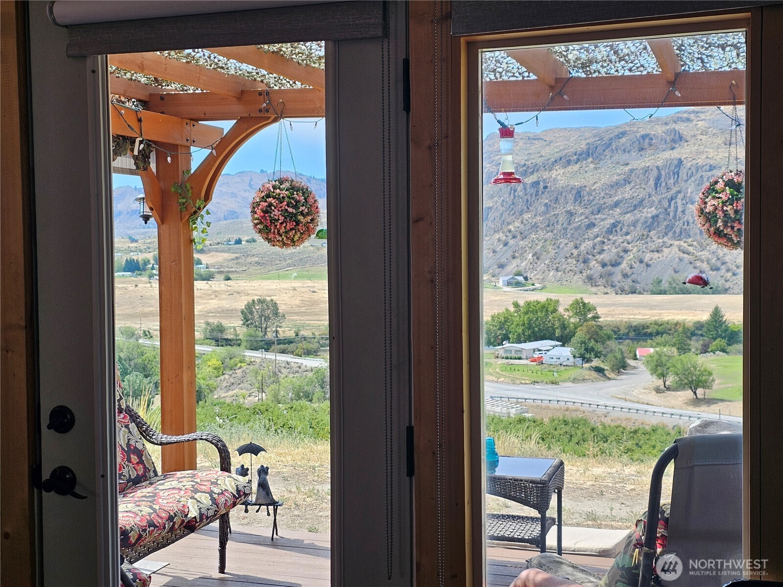 14 Bridgeview Road Tonasket, WA 98855 - Photo 7 of 28 a view of living room filled with furniture and a floor to ceiling window