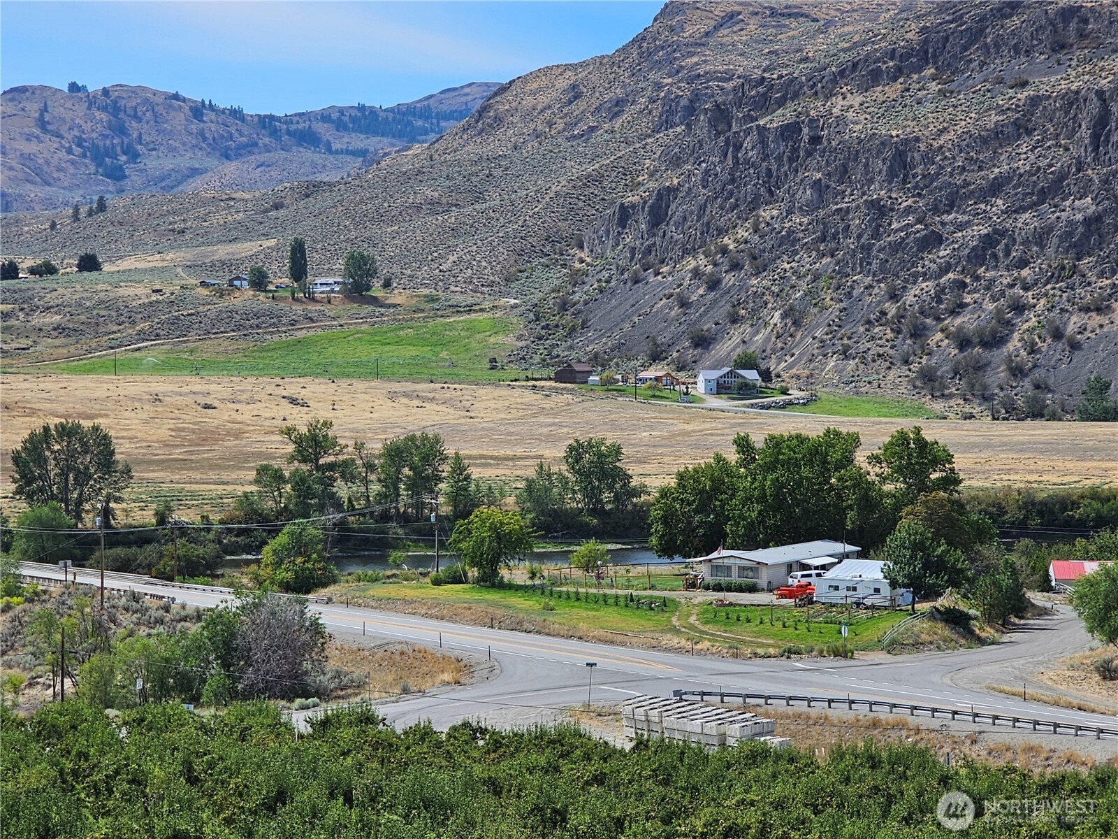 14 Bridgeview Road Tonasket, WA 98855 - Photo 8 of 28 a view of a town with mountains in the background