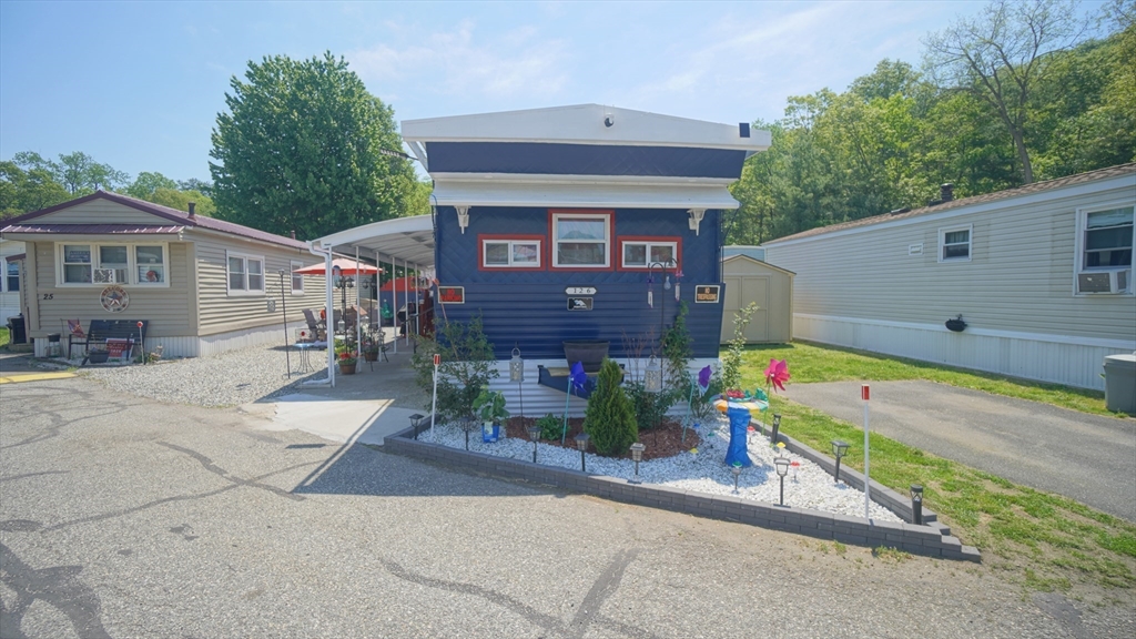 93 Grochmal Avenue, Unit 126 Springfield, MA 01151 - Photo 14 of 35 a front view of a house with a yard