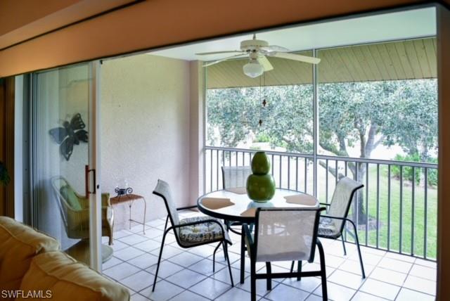 8083 Panther Trail, Unit 1504 Naples, FL 34113 - Photo 18 of 24 a view of a dining room with furniture window and outside view