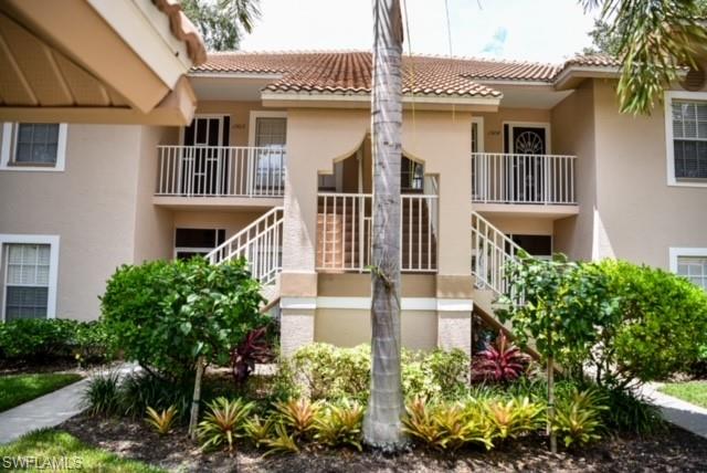 8083 Panther Trail, Unit 1504 Naples, FL 34113 - Photo 22 of 24 front view of a house with a garden