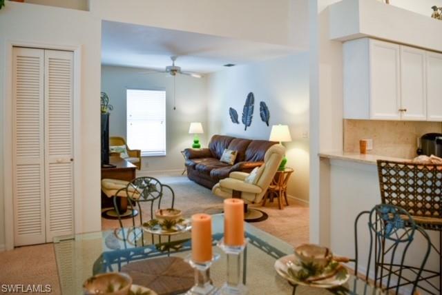 8083 Panther Trail, Unit 1504 Naples, FL 34113 - Photo 6 of 24 a living room with furniture