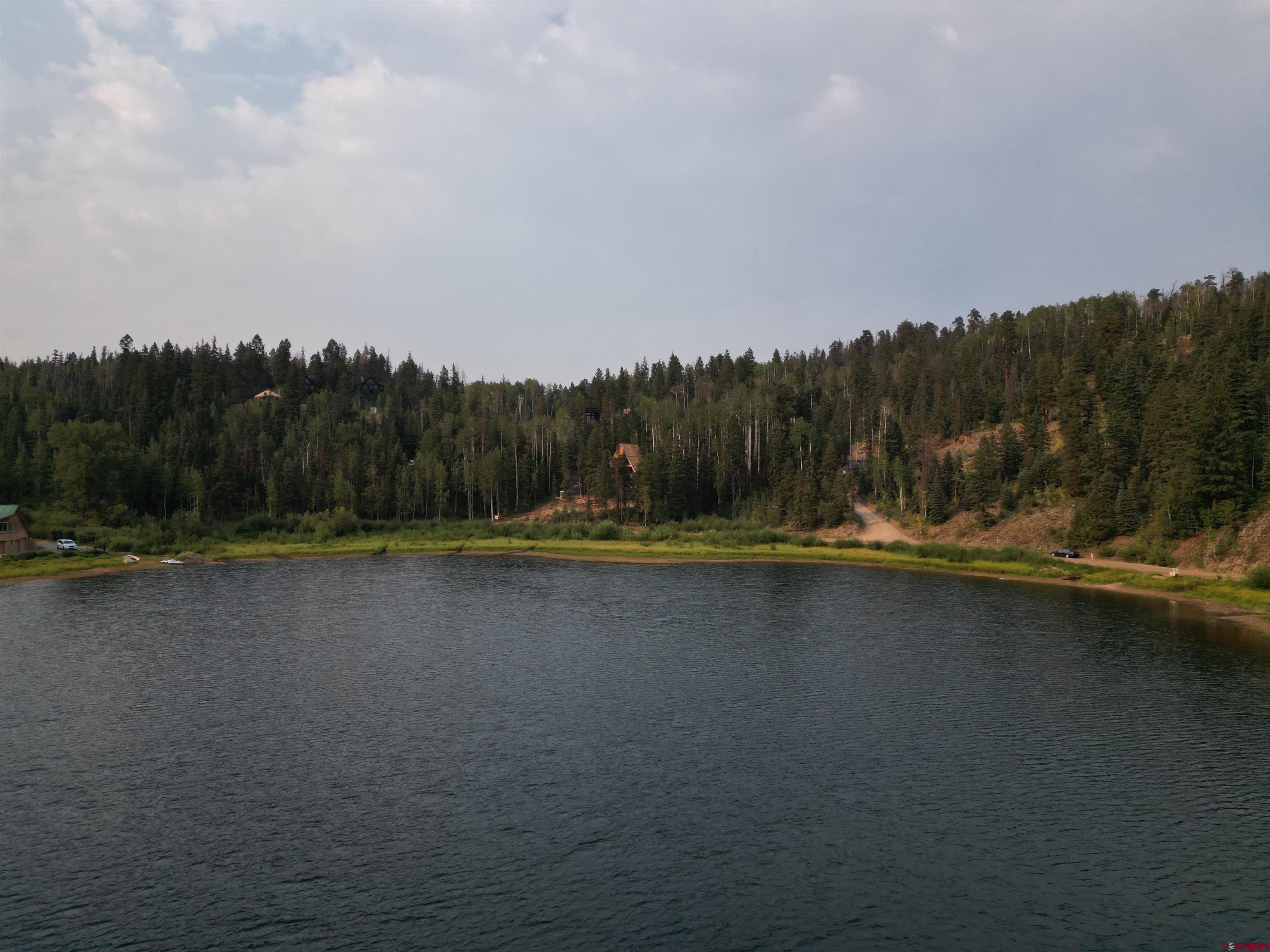 48 Ponderosa Way Durango, CO 81301 - Photo 23 of 24 a view of a swimming pool with a yard and large trees