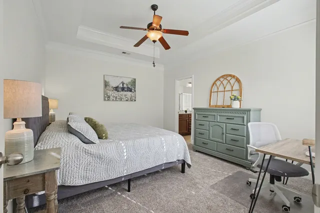 a bedroom with a bed and a dresser