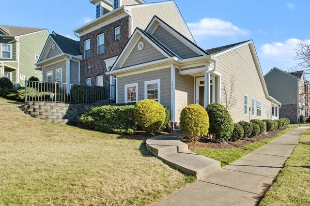 a front view of a house with garden