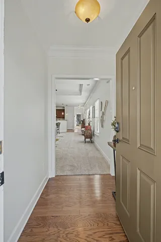 a view of a living room and hardwood floor