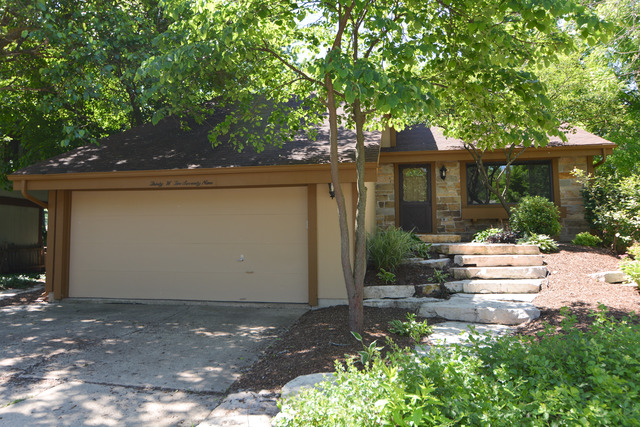 30W279 Ridgewood Court Warrenville, IL 60555 - Photo 1 of 23 a front view of a house with a yard