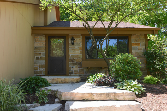 30W279 Ridgewood Court Warrenville, IL 60555 - Photo 2 of 23 a front view of a house with a yard