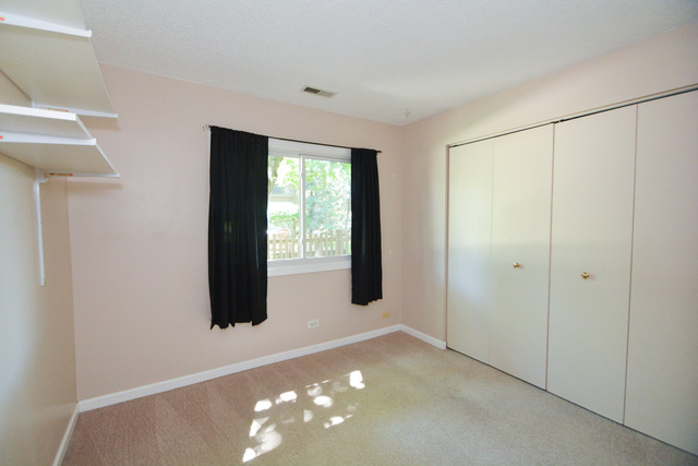 30W279 Ridgewood Court Warrenville, IL 60555 - Photo 12 of 23 a view of an empty room and window