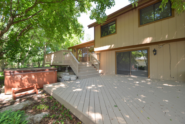 30W279 Ridgewood Court Warrenville, IL 60555 - Photo 20 of 23 a view of a house with backyard and sitting area