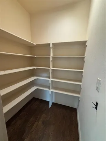 a storage room with wooden floor