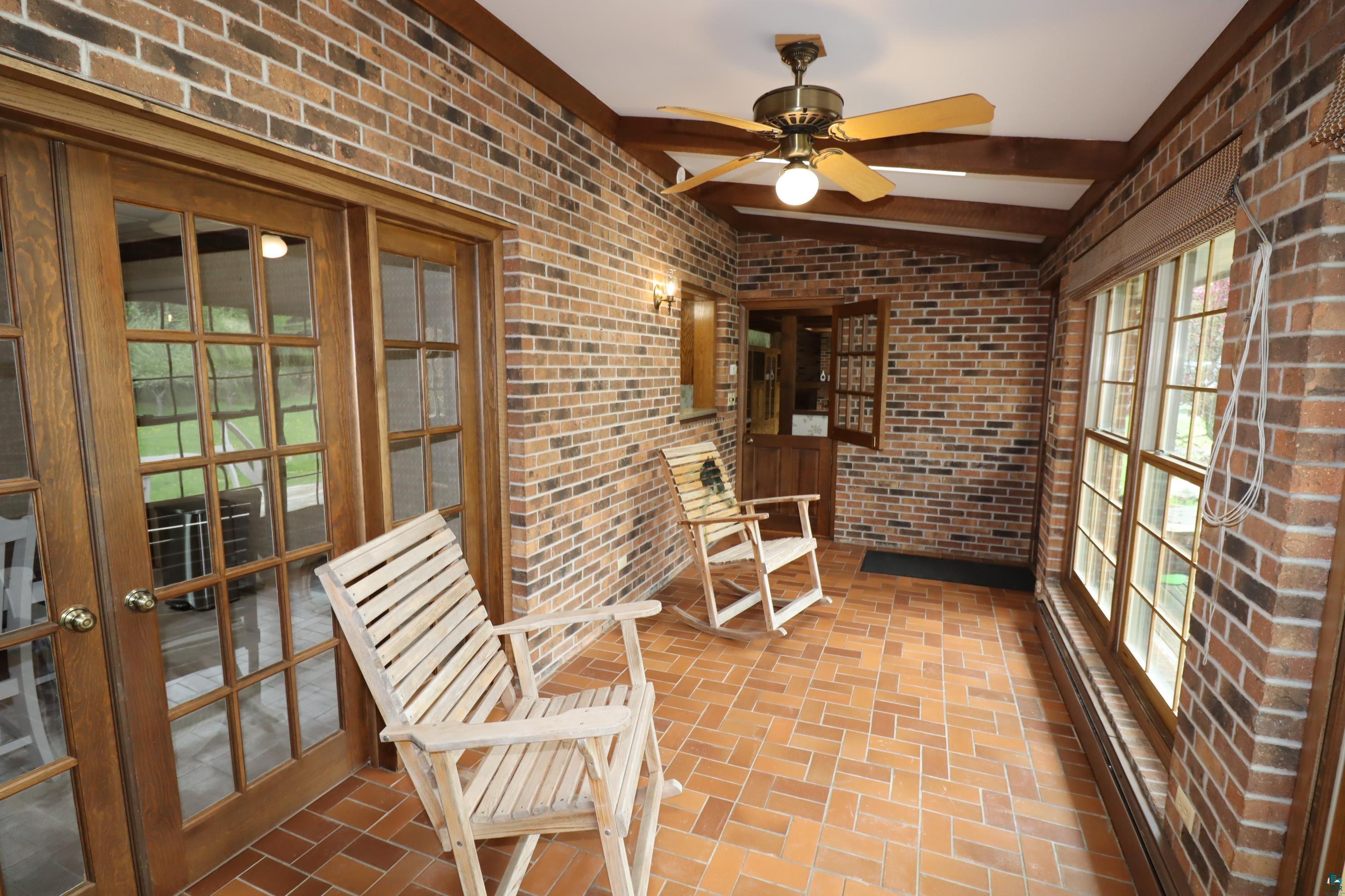 200 Maple Ridge Ashland, WI 54806 - Photo 14 of 40 Sunroom / solarium featuring plenty of natural light, ceiling fan, and french doors