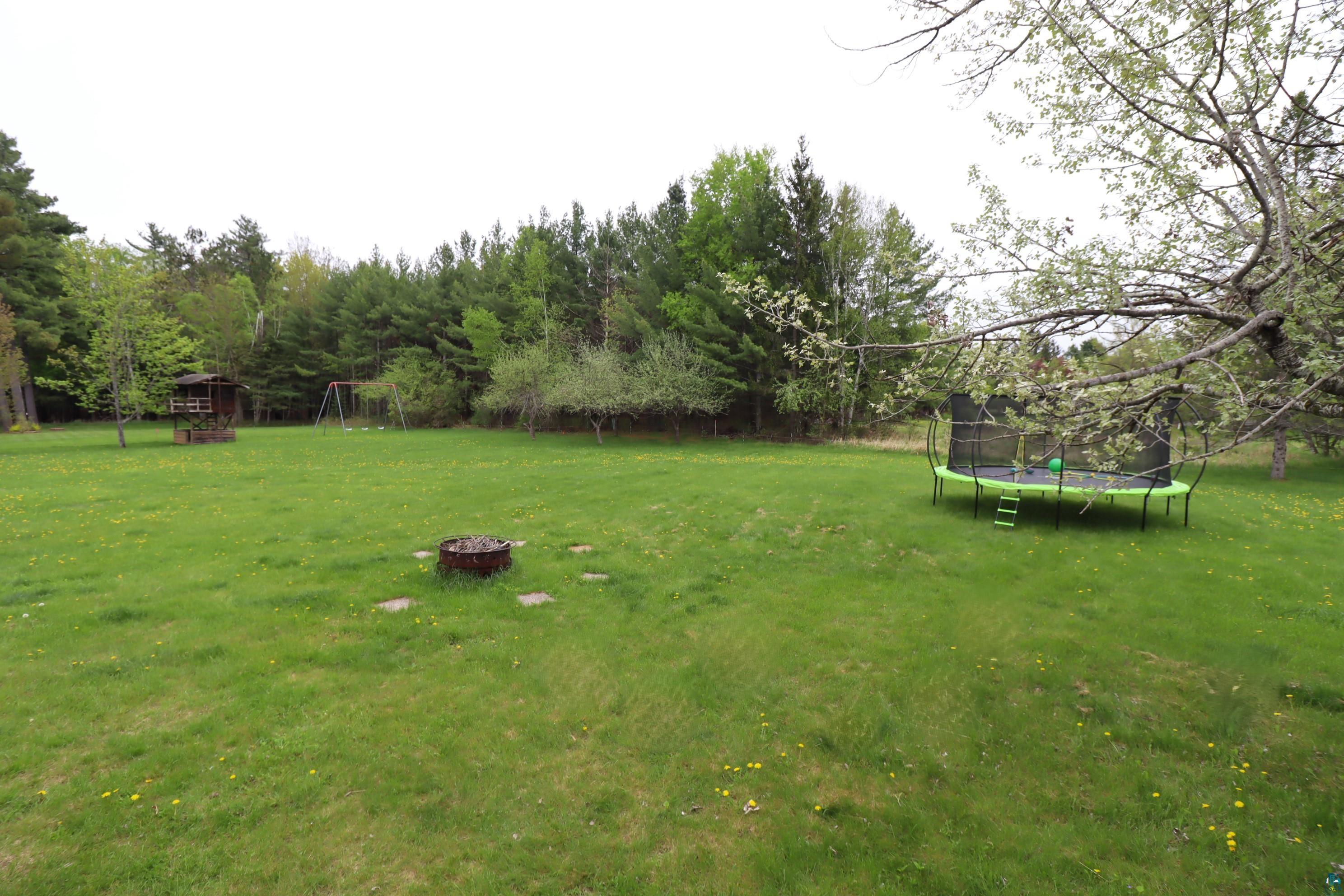200 Maple Ridge Ashland, WI 54806 - Photo 39 of 40 View of yard featuring a trampoline