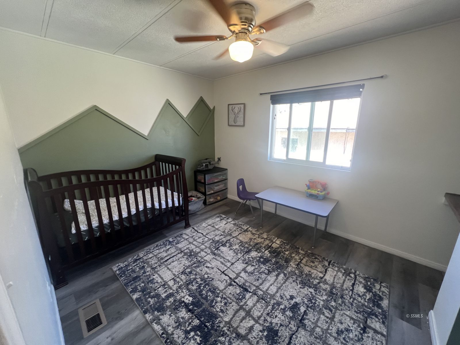 1341 North Calvert Boulevard Ridgecrest, CA 93555 - Photo 8 of 21 a bedroom with bed and a window