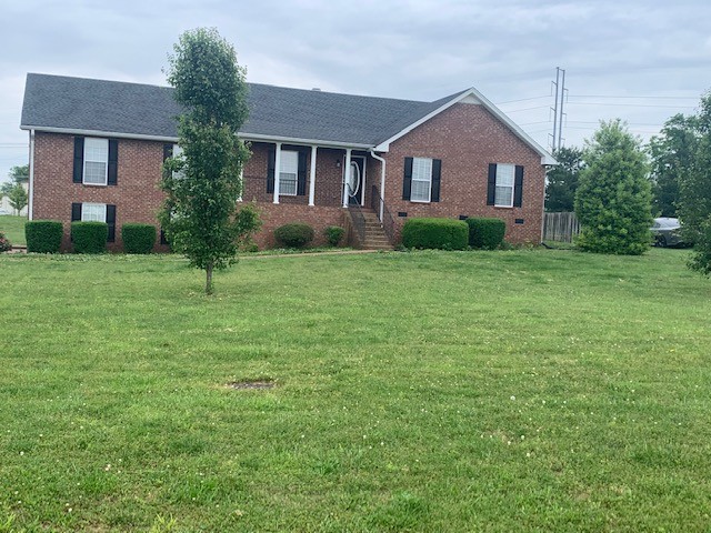 429 Fowler Ford Road Portland, TN 37148 - Photo 1 of 12 a front view of a house with a yard