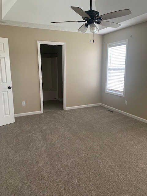 429 Fowler Ford Road Portland, TN 37148 - Photo 8 of 12 an empty room with a ceiling fan and a window