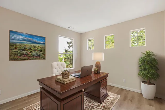 a bathroom with a sink a toilet a shower and a mirror