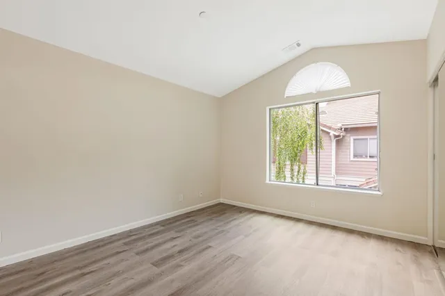 a bathroom with a double vanity sink a mirror and a bathtub
